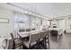 Kitchen and dining area with a large island and hardwood floors at 7587 Wright Ct, Arvada, CO 80005