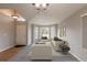 Virtually staged living room featuring a bay window and neutral decor at 16523 Prairie Flower Pl, Parker, CO 80134