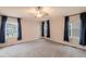 Spacious main bedroom with neutral walls and carpet at 16523 Prairie Flower Pl, Parker, CO 80134