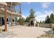 Outdoor patio with built-in fireplace and grill at 12421 High Country Trl, Littleton, CO 80127