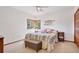Comfortable guest bedroom with a queen-size bed and a peaceful view at 12421 High Country Trl, Littleton, CO 80127