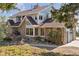 House exterior with stone and siding, showcasing a large deck and garage at 12421 High Country Trl, Littleton, CO 80127