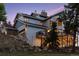 House exterior showcasing a large deck and hillside location at 12421 High Country Trl, Littleton, CO 80127