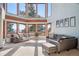 Living room with large windows offering scenic views at 12421 High Country Trl, Littleton, CO 80127