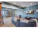 Spacious basement rec room with a comfortable seating area and large TV at 12421 High Country Trl, Littleton, CO 80127