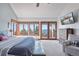 Spacious main bedroom with mountain views and private access to a deck at 12421 High Country Trl, Littleton, CO 80127