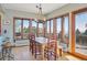 Bright dining area with large windows and mountain views at 12421 High Country Trl, Littleton, CO 80127