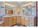Double vanity bathroom with ample storage and natural light at 12421 High Country Trl, Littleton, CO 80127