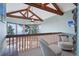 Relaxing loft area with vaulted ceilings, comfy chairs, and scenic views at 12421 High Country Trl, Littleton, CO 80127