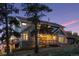 Two-story home with stone and siding, deck, and mountain views at 12421 High Country Trl, Littleton, CO 80127