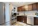 Kitchen with stainless steel appliances and updated countertops at 1626 S Sheridan Blvd, Denver, CO 80232