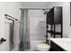 Updated bathroom with shower/tub combo and storage at 1626 S Sheridan Blvd, Denver, CO 80232