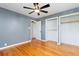 Bright bedroom with hardwood floors and ample closet space at 1626 S Sheridan Blvd, Denver, CO 80232