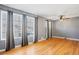 Living room with hardwood floors and large windows at 1626 S Sheridan Blvd, Denver, CO 80232