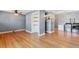 Dining room with hardwood floors and built-in shelving at 1626 S Sheridan Blvd, Denver, CO 80232