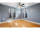 Bright bedroom with hardwood floors and ample natural light at 1626 S Sheridan Blvd, Denver, CO 80232
