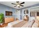 Virtually staged bedroom with large closet and built-in desk at 1626 S Sheridan Blvd, Denver, CO 80232