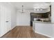 Dining area with hardwood floors and kitchen access at 1123 S Alton St # A, Denver, CO 80247