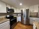 Modern kitchen featuring stainless steel appliances at 5603 S Pagosa Ct, Centennial, CO 80015