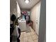 Laundry room with washer, dryer, and storage at 5603 S Pagosa Ct, Centennial, CO 80015