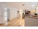 Modern dining room with hardwood floors and kitchen view at 9216 E Lehigh Ave, Denver, CO 80237