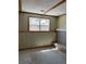 Unfinished basement with a brick fireplace and carpeted floor at 12756 E Exposition Ave, Aurora, CO 80012