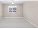 Spacious bedroom with ceiling fan and large window at 9019 E Panorama Cir # D211, Centennial, CO 80112