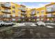 Exterior of the building with parking and landscaping at 9019 E Panorama Cir # D211, Centennial, CO 80112