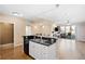 Modern kitchen with island, stainless steel appliances, and hardwood floors at 9019 E Panorama Cir # D211, Centennial, CO 80112