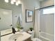 Modern bathroom with white subway tile, a soaking tub, and updated vanity at 16707 Greyhawk Dr, Monument, CO 80132