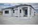 Exterior view of a ranch-style home with a covered patio at 16707 Greyhawk Dr, Monument, CO 80132