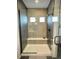 Large walk-in shower with built-in seat and modern tile at 16707 Greyhawk Dr, Monument, CO 80132
