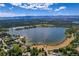 Wide aerial view of lake and surrounding houses at 5230 Bow Mar Dr, Littleton, CO 80123