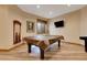 Basement game room featuring a pool table at 5230 Bow Mar Dr, Littleton, CO 80123