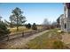Landscaped backyard with golf course views at 1366 Teton Pt, Lafayette, CO 80026