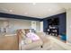Finished basement with sectional sofa and entertainment center at 1366 Teton Pt, Lafayette, CO 80026