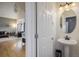 Convenient half bathroom with pedestal sink and mirror at 1366 Teton Pt, Lafayette, CO 80026