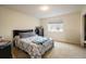 Bright bedroom with a queen bed and window at 1366 Teton Pt, Lafayette, CO 80026