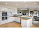 Modern kitchen with white cabinets, stainless steel appliances, and tile counters at 1366 Teton Pt, Lafayette, CO 80026