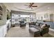 Open concept living and kitchen space with a view of the backyard at 1366 Teton Pt, Lafayette, CO 80026