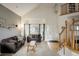 Living room with gray walls, comfy sofas, and large windows at 1366 Teton Pt, Lafayette, CO 80026
