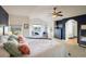 Large main bedroom with tray ceiling, golf course view, and ensuite bathroom at 1366 Teton Pt, Lafayette, CO 80026