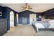 Spacious main bedroom with dark blue accent wall and ensuite bathroom at 1366 Teton Pt, Lafayette, CO 80026