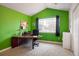Home office with a large desk and window at 1366 Teton Pt, Lafayette, CO 80026