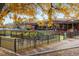 Outdoor patio seating area with garden and fall foliage at 1366 Teton Pt, Lafayette, CO 80026