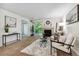 Living room with fireplace, balcony access, and neutral decor at 8813 Colorado Blvd # 207, Thornton, CO 80229