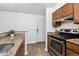 Updated kitchen features granite countertops and stainless steel appliances at 8813 Colorado Blvd # 207, Thornton, CO 80229