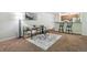 Open living room with kitchen views and neutral decor at 8813 Colorado Blvd # 207, Thornton, CO 80229