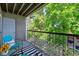 Private balcony overlooking a tree-filled area at 8813 Colorado Blvd # 207, Thornton, CO 80229