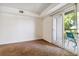 Spacious bedroom with balcony access and carpeted floor at 8813 Colorado Blvd # 207, Thornton, CO 80229